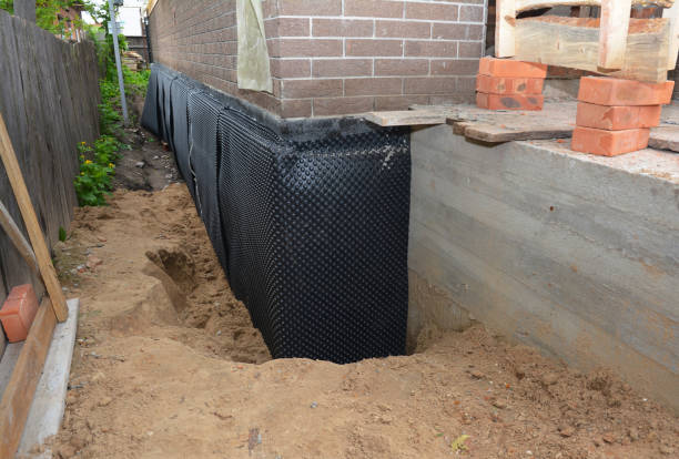 Happy homeowners after waterproofing job in Wheeler